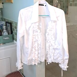 A  blouse with 6hidden buttons.The details down front & sleeves are hearts.